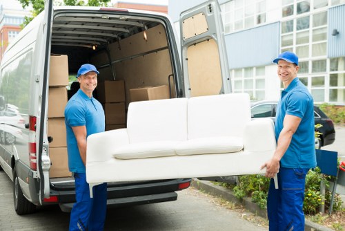 Moving boxes and furniture prepared for a flat removal in Hanworth